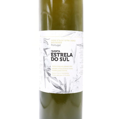 A bottle of Quinta Estrela do Sul extra virgin olive oil, showing the dark olive-green liquid inside a clear glass bottle with a white paper label featuring botanical illustrations.