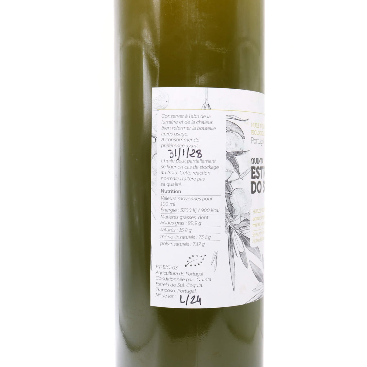 green glass bottle with white label