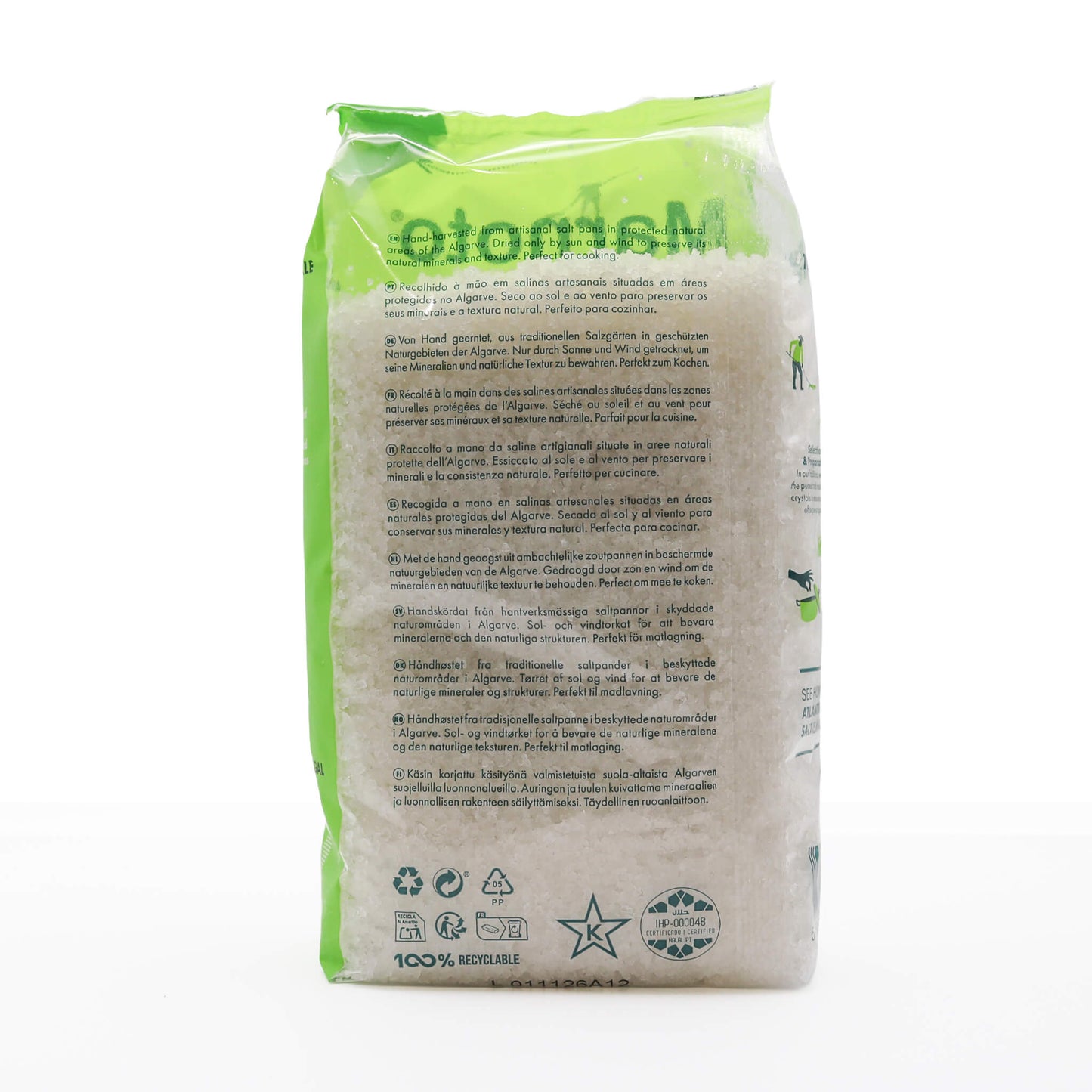 Bag of salt with green and white label on a white background