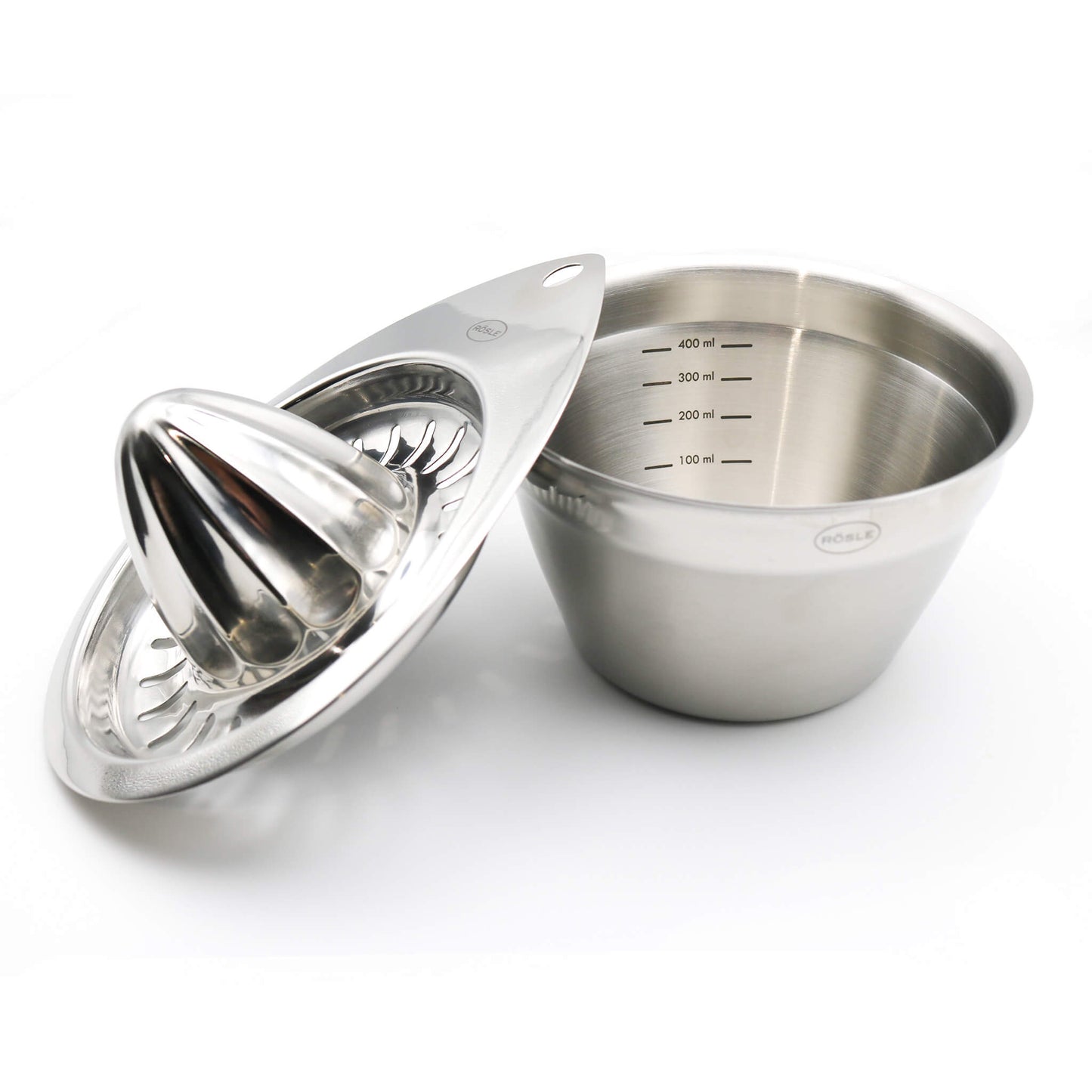 Stainless steel citrus juicer with measuring markings on a white background