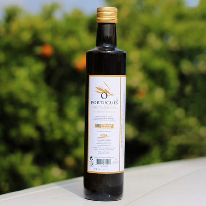 Bottle of Portuguese olive oil with a blurred green outdoor background