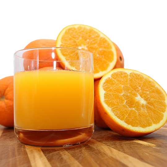 Fresh Algarve oranges with a glass of natural orange juice. These sun-drenched, chemical-free oranges are sweet, juicy, and perfect for a healthy drink.