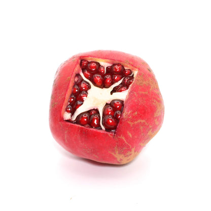 fresh pomegranate with top cut open