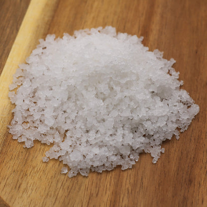 Coarse salt on a wooden surface