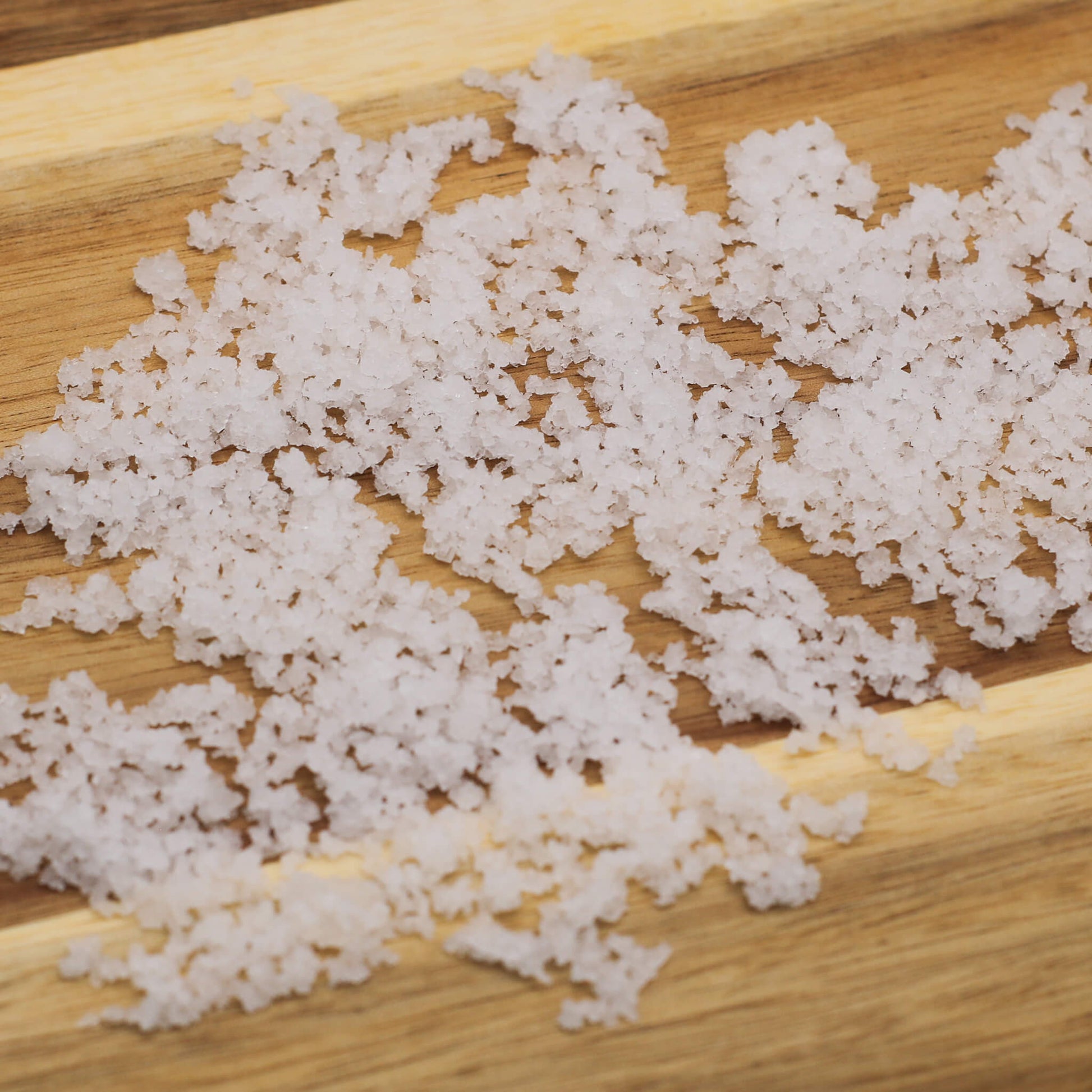 White salt product on a wooden surface